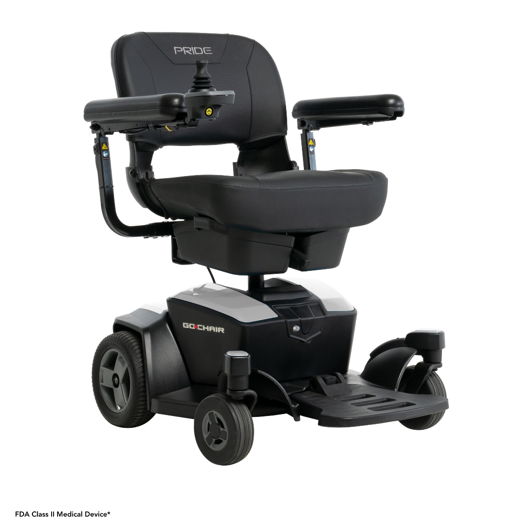 The Pride Mobility Go Chair® Portable Powerchair is a black and gray foldable electric wheelchair with cushioned seat and backrest, right-arm joystick control, armrests, and four wheels for easy mobility assistance.
